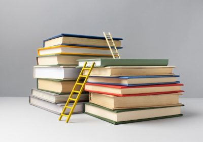 front-view-stacked-books-ladders-education-day-min