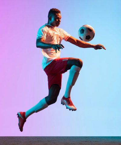 one-man-professional-soccer-football-player-training-isolated-gradient-wall_155003-37515-min