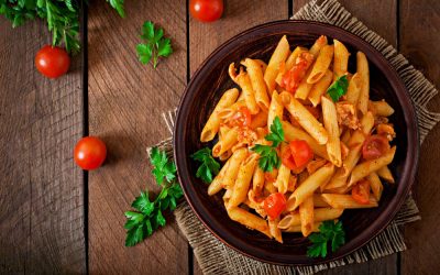 penne-pasta-tomato-sauce-with-chicken-tomatoes-wooden-table-min