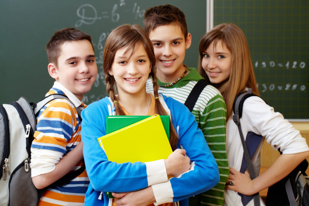 smiling-students-with-backpacks-min