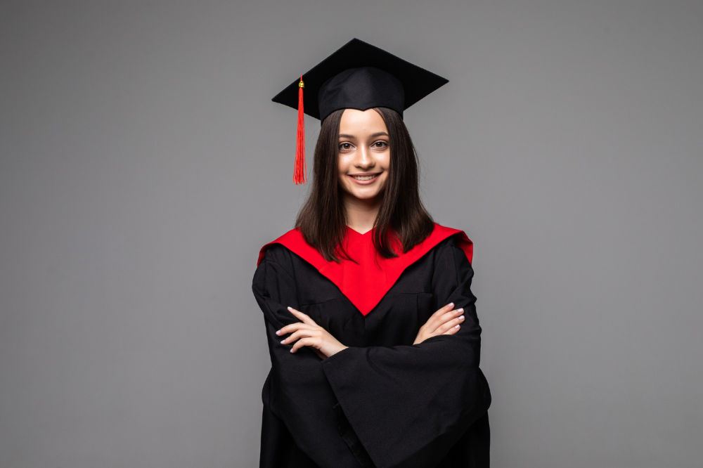 studio-portrait-funny-excited-joyful-student-girl-with-graduation-certificate-min