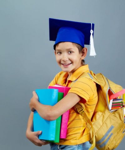 successful-child-with-graduation-cap-backpack-full-books-min